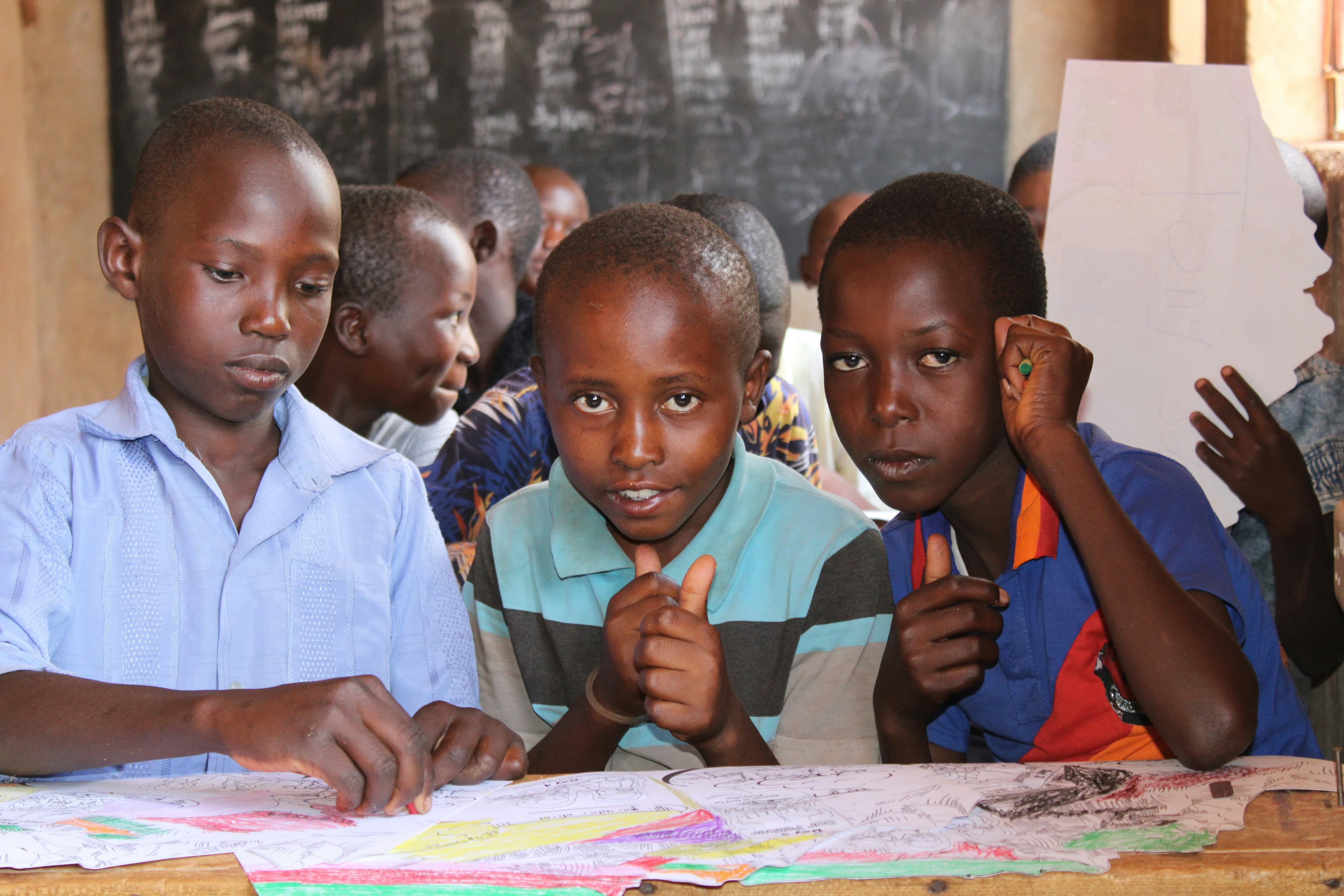 Happy children reading books and learning - Seed of Life education program